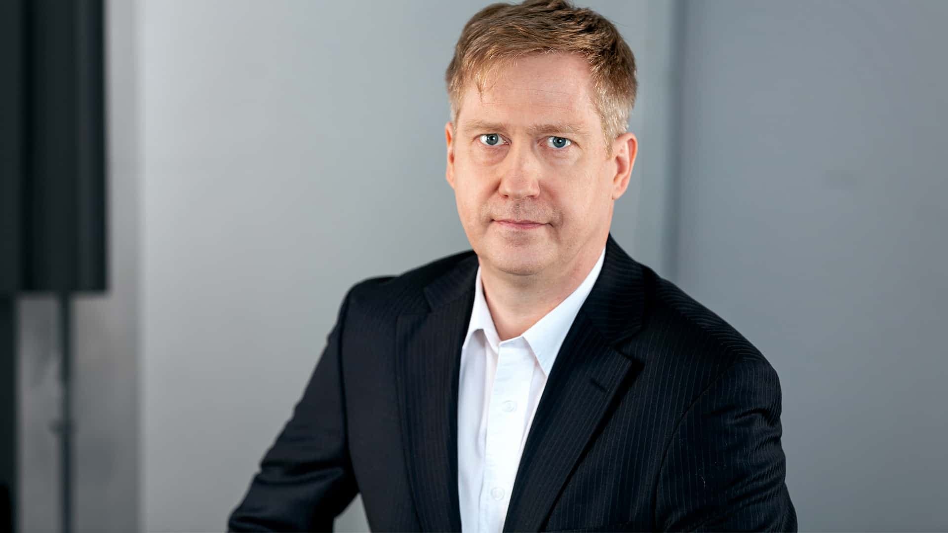 Porträttbild på forskaren Karsten Ruscher.